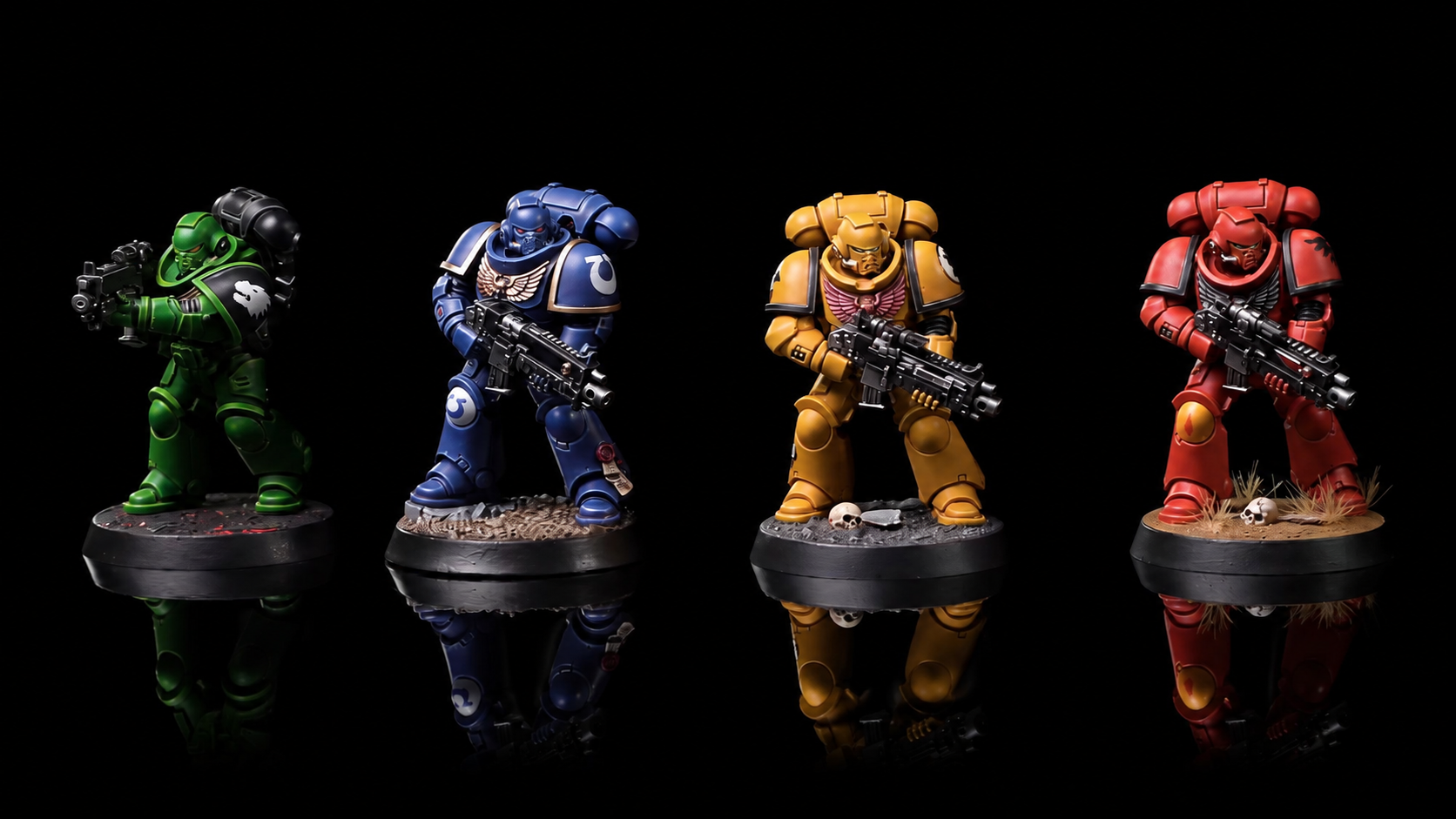 Fire modeller malet i grønt, blåt, gult og rødt med Warhammer Tone Pro